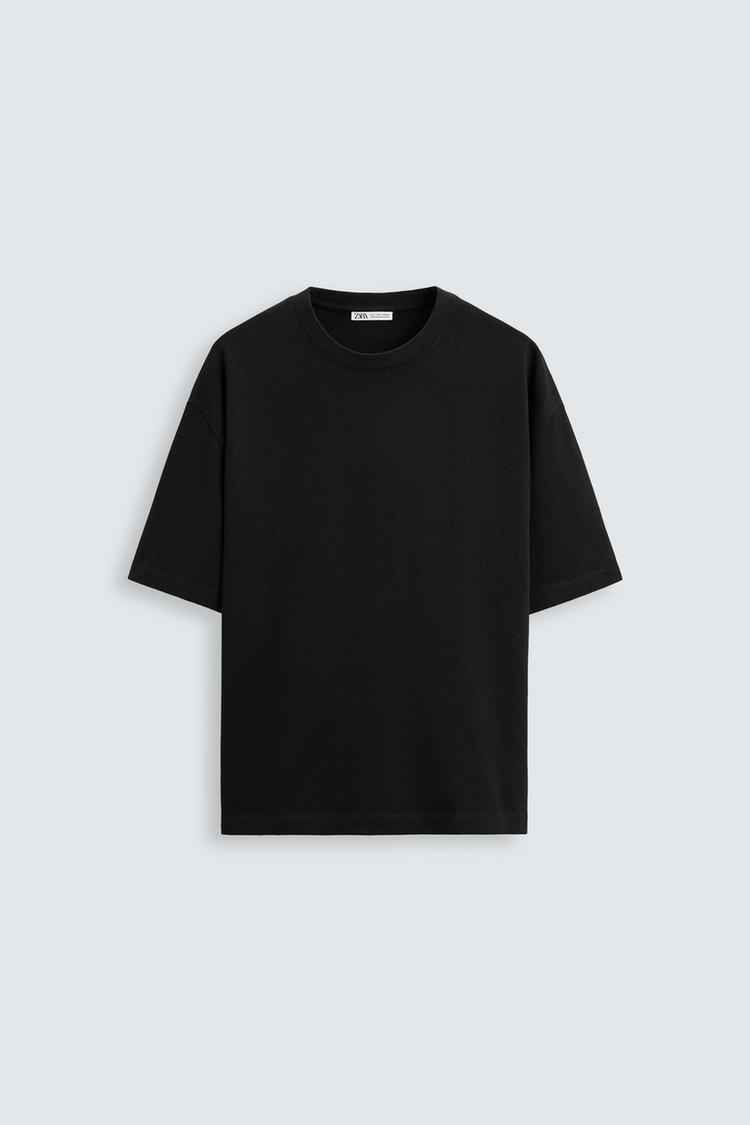 Black t-shirt on a light gray background